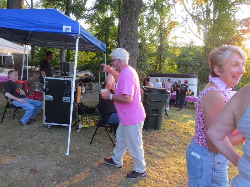 DJ setup and people dancing at Boobstock